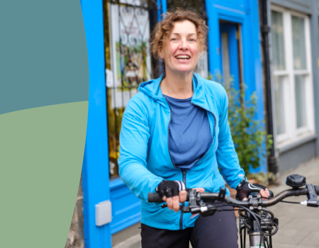 Woman standing with a bike