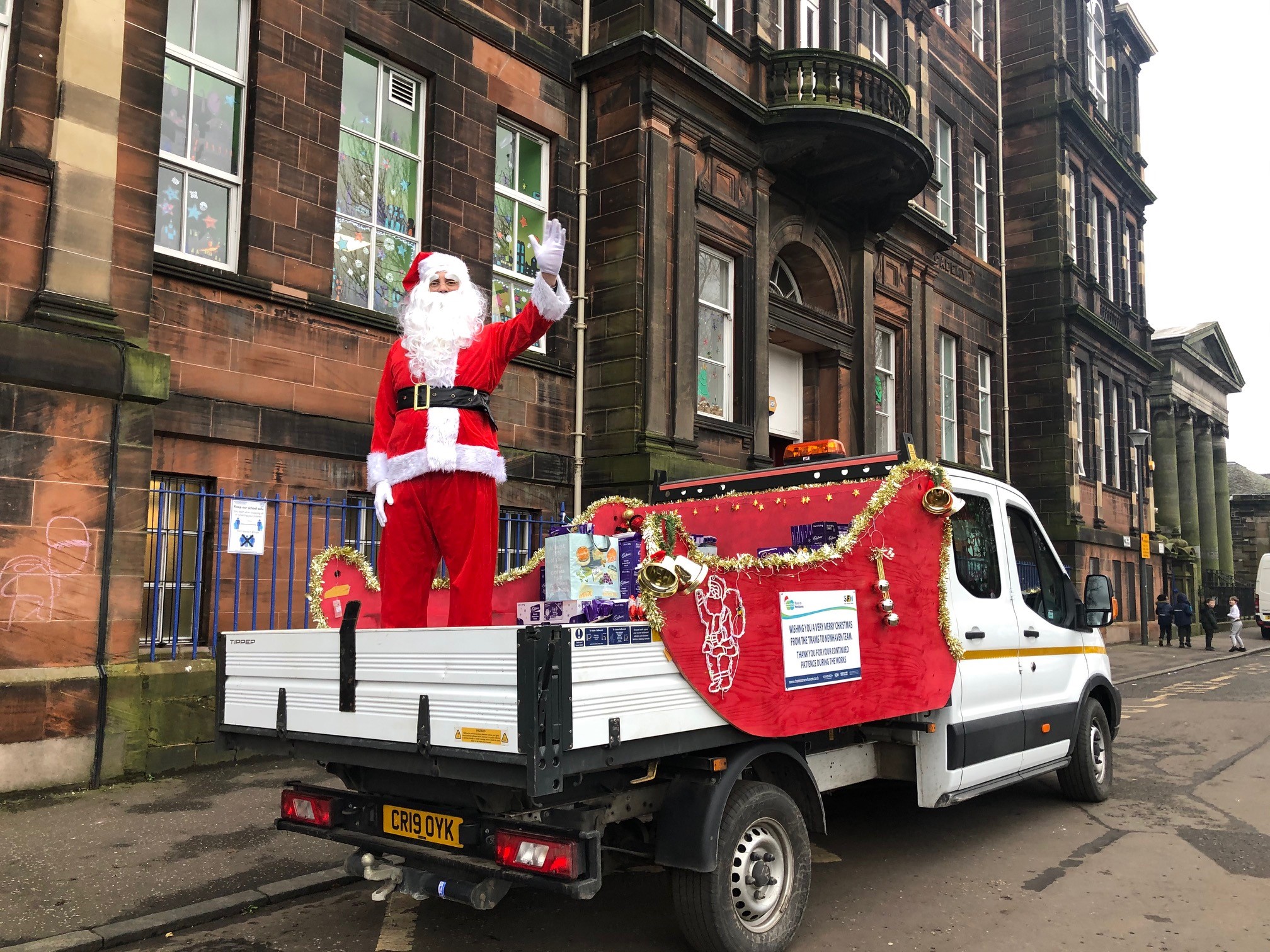 Santa standing on the Trams to Newhaven sleigh/pick up hybrid vehicle.