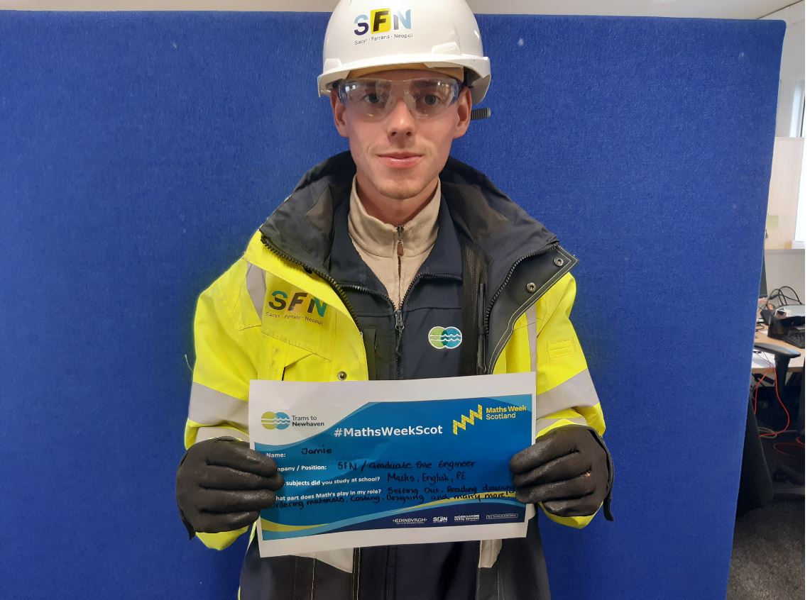 SFN Graduate Engineer Jamie holding his Maths Week Scotland sign.