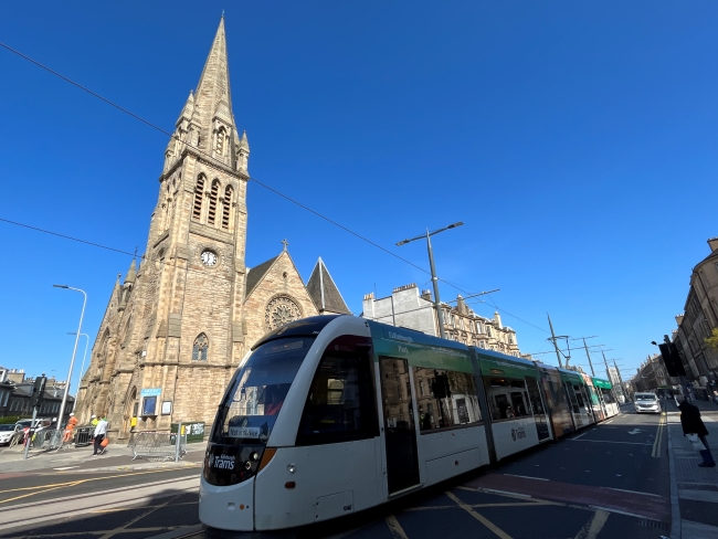 Photo of a tram passing by Pilrig St Paul Church