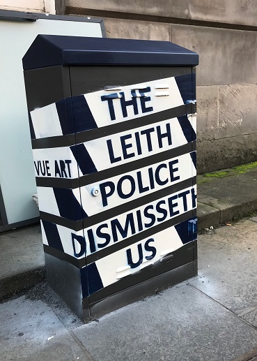 Mural painted in black and white with the wording The Leith Police Dismisseth Us on it.