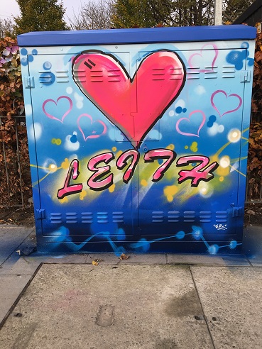 Colourful mural painted on Leith Walk with a red loveheart. 